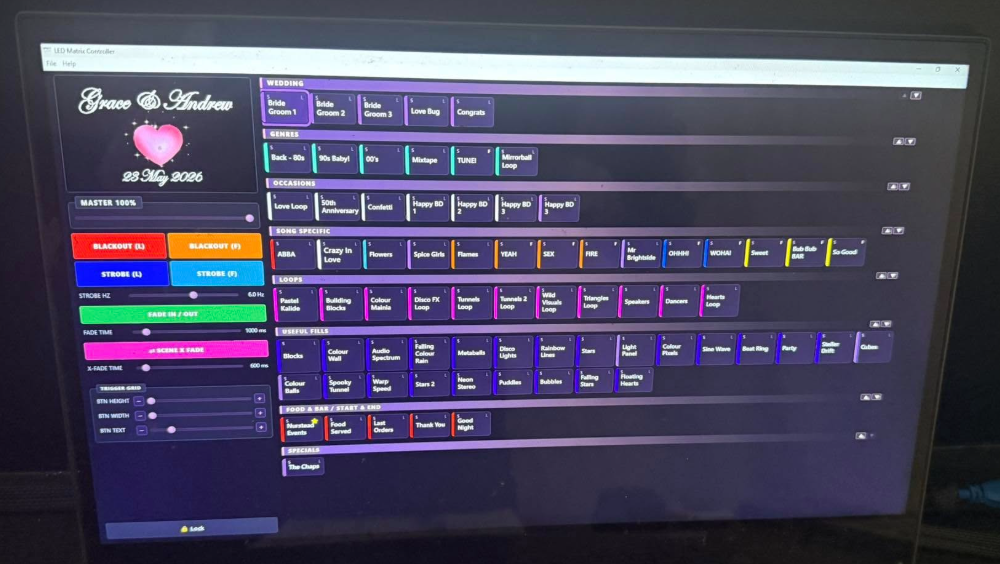 LMS Show Mode running live on a touchscreen kiosk, branded for a wedding — Grace & Andrew, 23 May 2026, with scene buttons grouped into WEDDING / GENRES / OCCASIONS / SONG SPECIFIC / LOOPS sections
